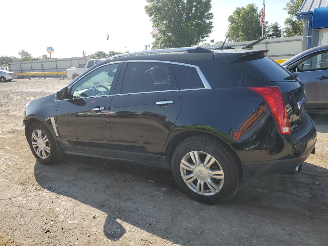 2012 Cadillac SRX VIN 3GYFNDE35CS659804 Copart auction photo, all over damage thumbnail 2