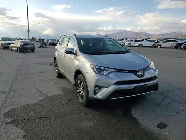 2018 Toyota RAV 4 VIN 2T3RFREV6JW791193 Copart auction photo, rear end damage thumbnail 12