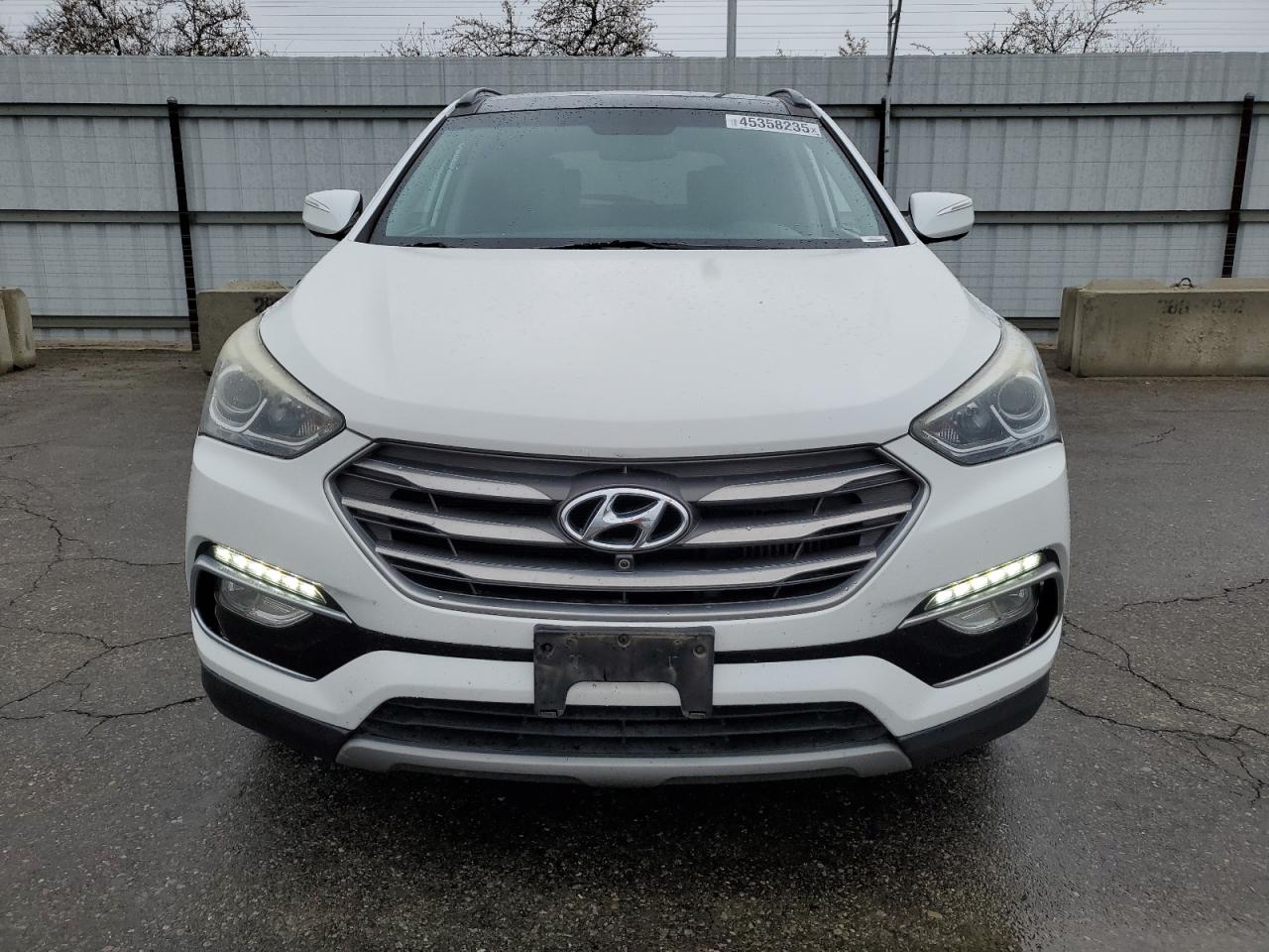 2017 Hyundai Santa Fe VIN 5XYZW4LA0HG501512 Copart auction photo, minor dent/scratches damage thumbnail 5