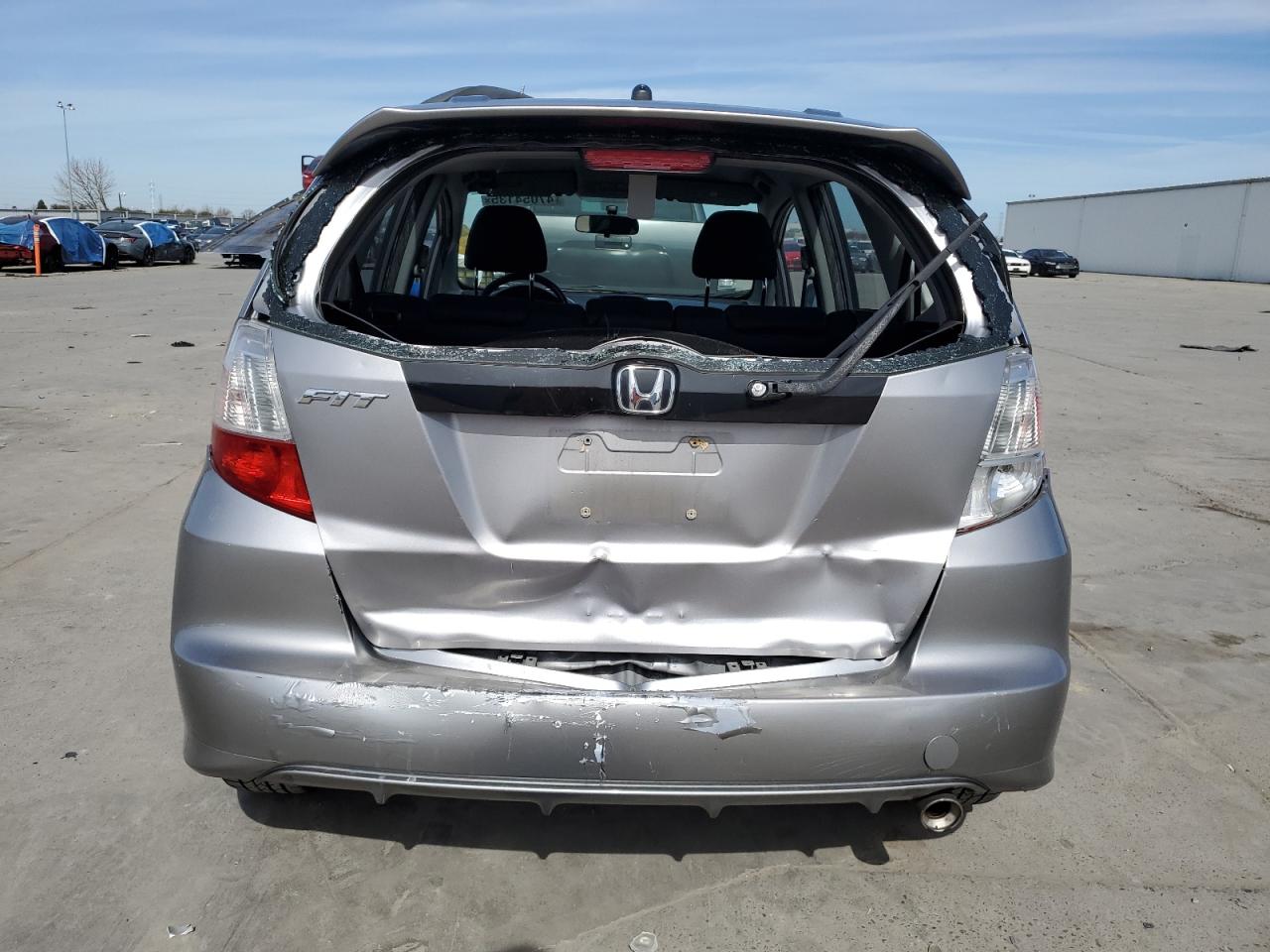 2009 Honda Fit VIN JHMGE88409S001770 Copart auction photo, rear end damage thumbnail 6