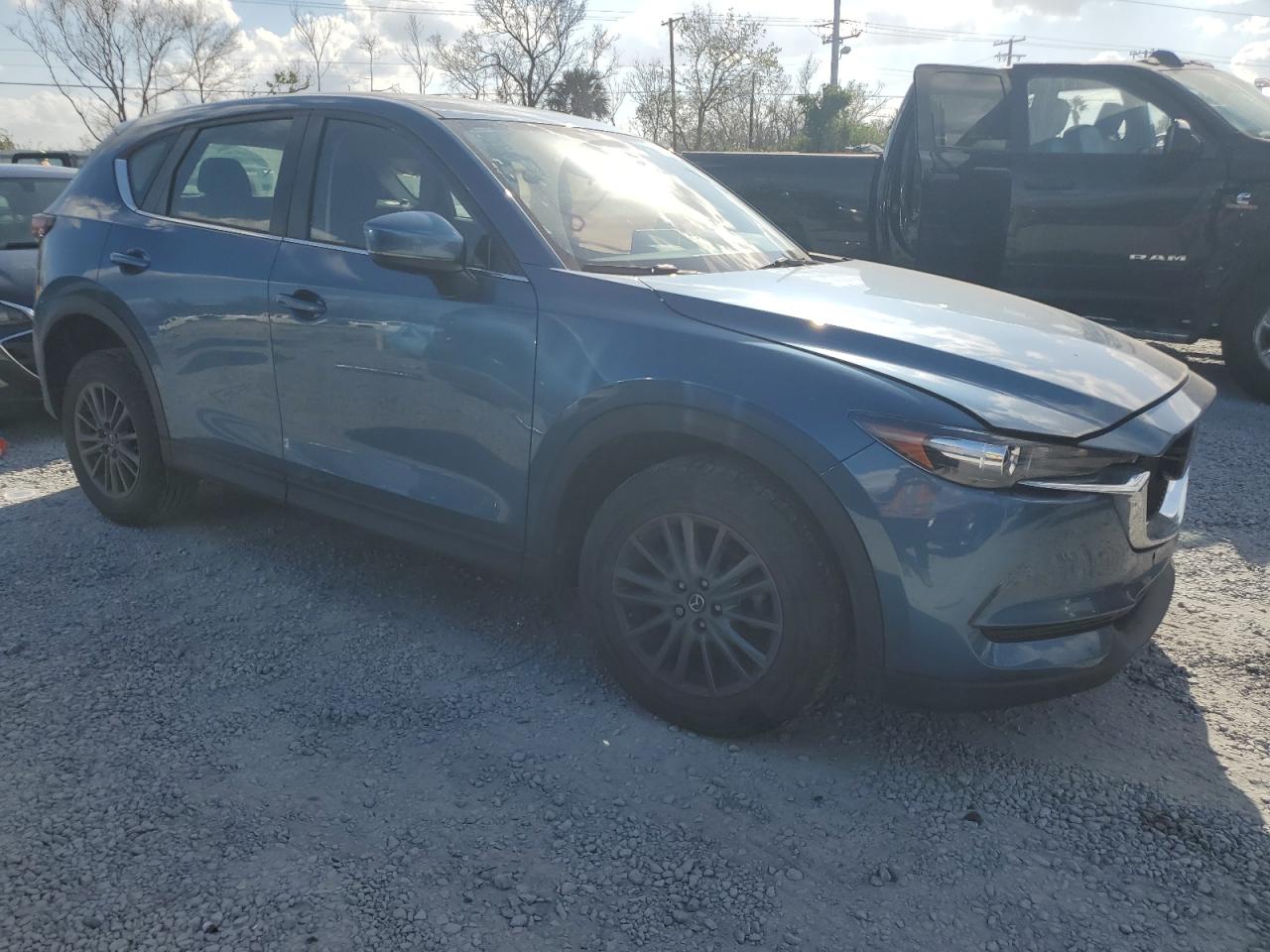 2021 Mazda CX-5 VIN JM3KFABM1M0414219 Copart auction photo, side / minor dent/scratches damage thumbnail 4