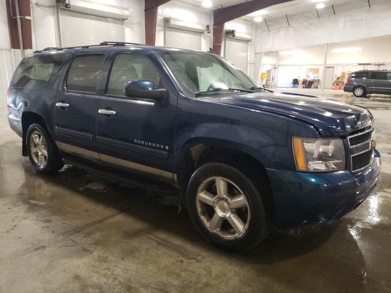 2007 Chevrolet Suburban VIN 1GNFK16317J215782 Copart auction photo, rear end / hail damage thumbnail 4