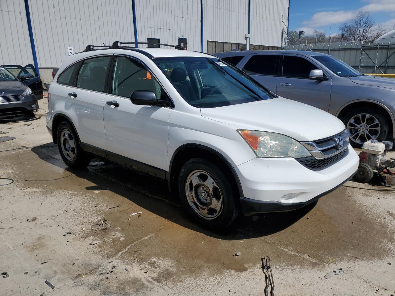 2010 Honda CR-V VIN 5J6RE4H33AL097350 Copart auction photo, side / front end damage thumbnail 4