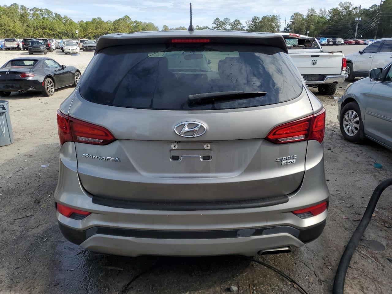 2018 Hyundai Santa Fe VIN 5NMZTDLB6JH059011 Copart auction photo, front end damage thumbnail 6