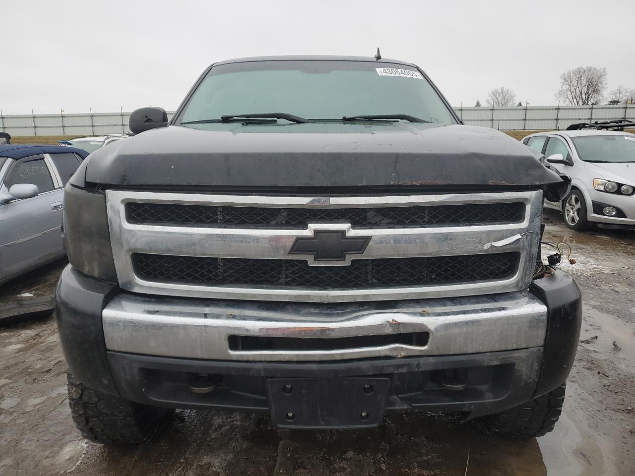 2009 Chevrolet Silverado VIN 1GCEK19CX9Z263401 Copart auction photo, front end / side damage thumbnail 5