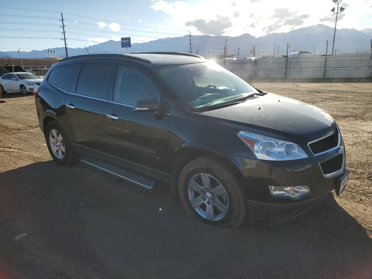 2010 Chevrolet Traverse VIN 1GNLVFED7AS112773 Copart auction photo, side / front end damage thumbnail 4