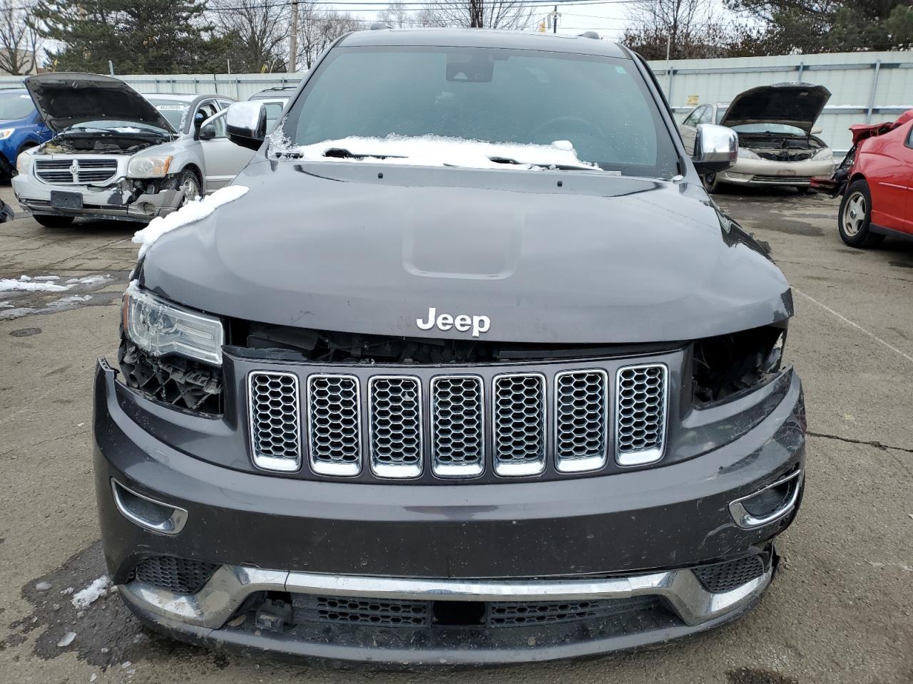 2016 Jeep Grand Cherokee VIN 1C4RJFJT9GC493024 Copart auction photo, front end / side damage thumbnail 5