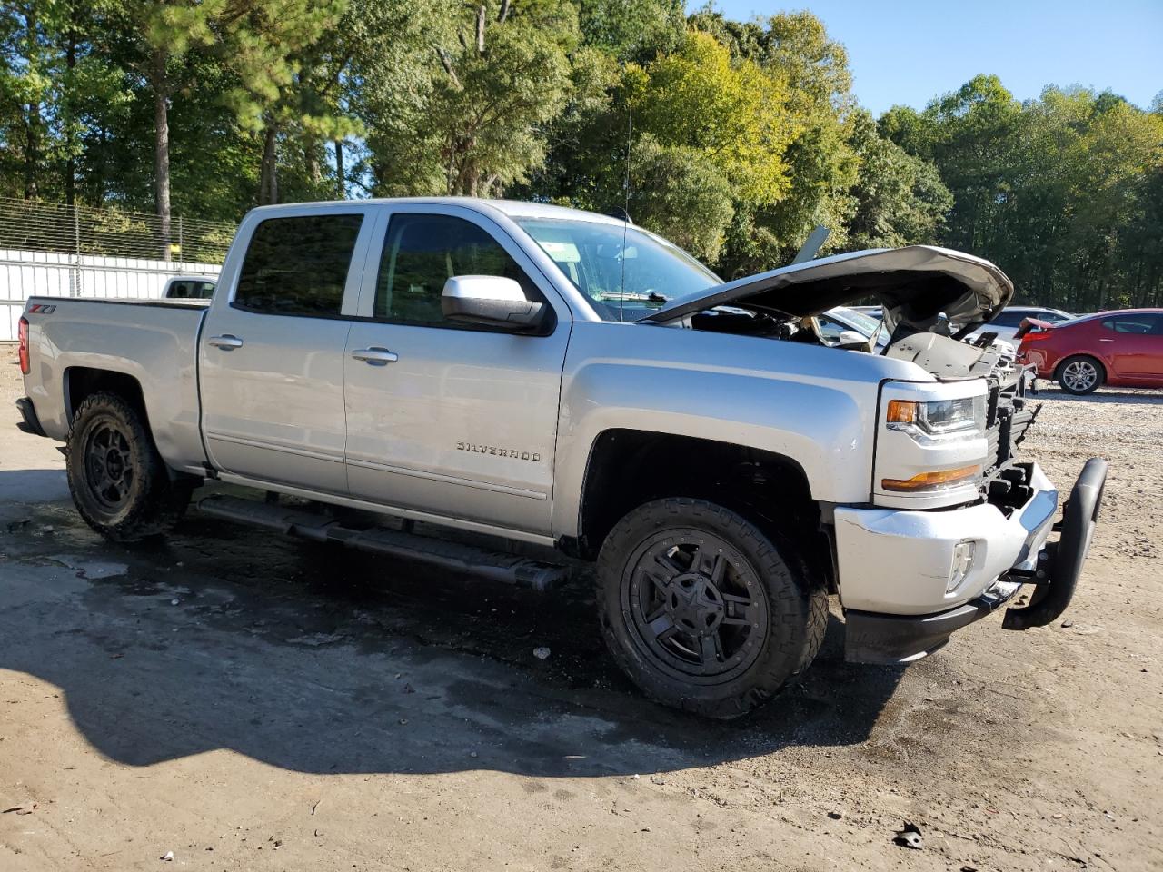 2018 Chevrolet Silverado VIN 3GCUKREC3JG142925 Copart auction photo, front end / side damage thumbnail 4