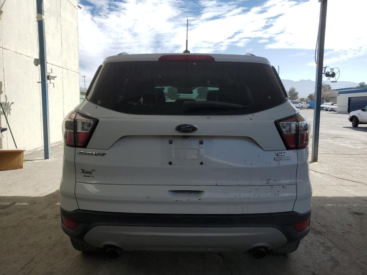 2017 Ford Escape VIN 1FMCU0GD1HUE02085 Copart auction photo, front end / minor dent/scratches damage thumbnail 6