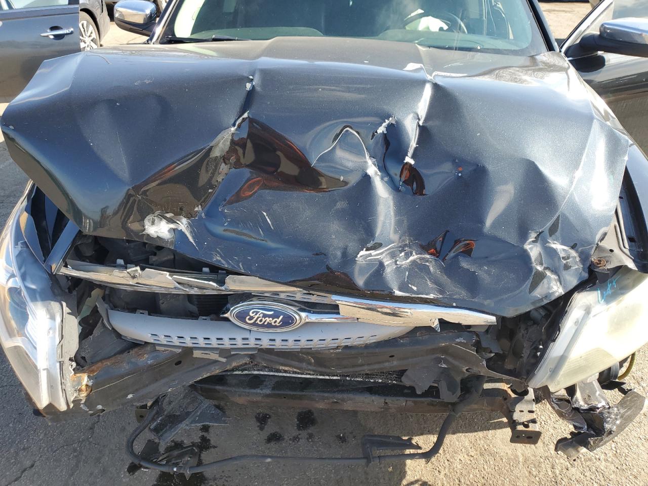 2011 Ford Taurus VIN 1FAHP2FW3BG129128 Copart auction photo, front end / undercarriage damage thumbnail 12
