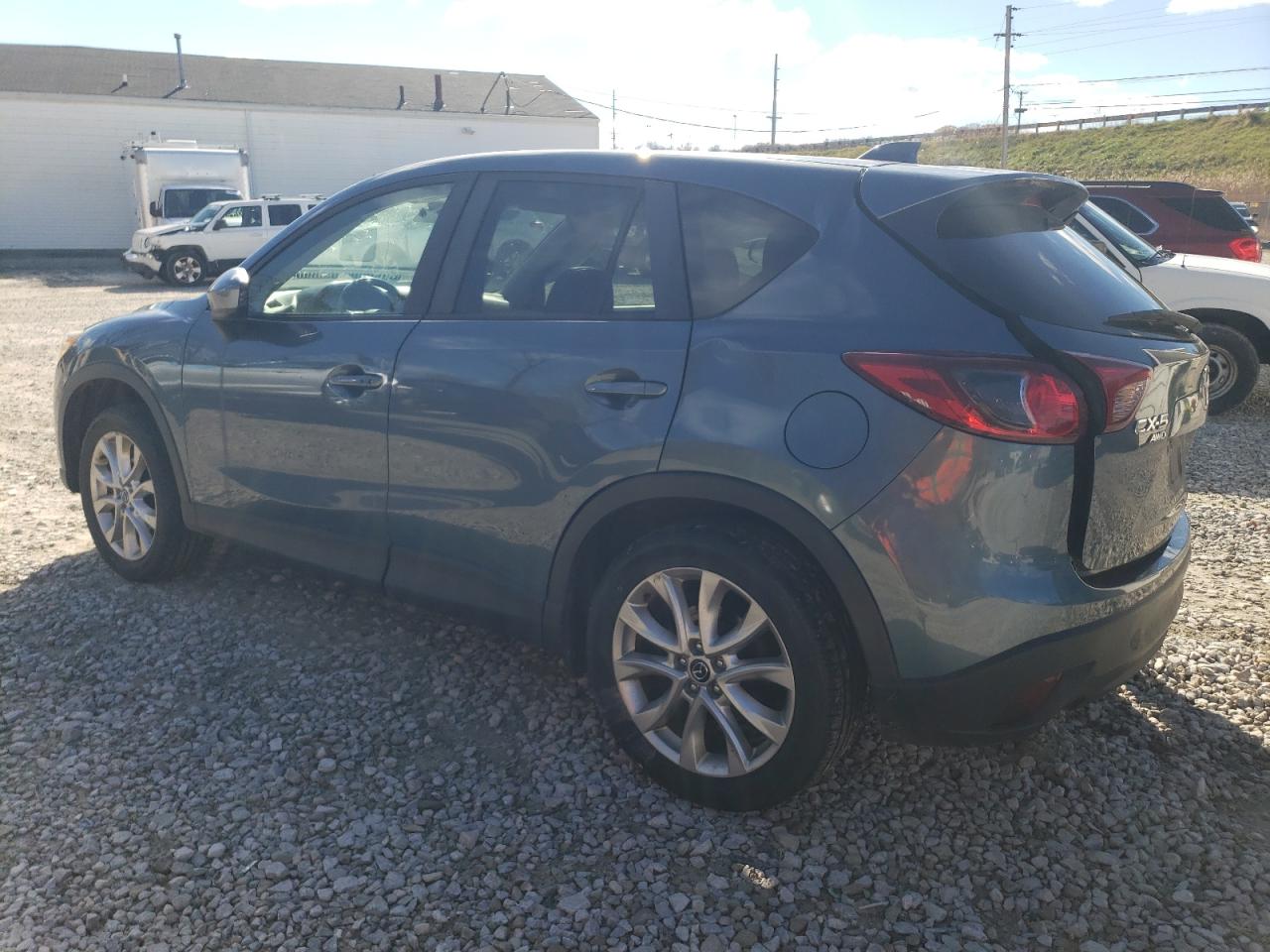 2015 Mazda CX-5 VIN JM3KE4DY8F0449346 Copart auction photo, side / rear end damage thumbnail 2