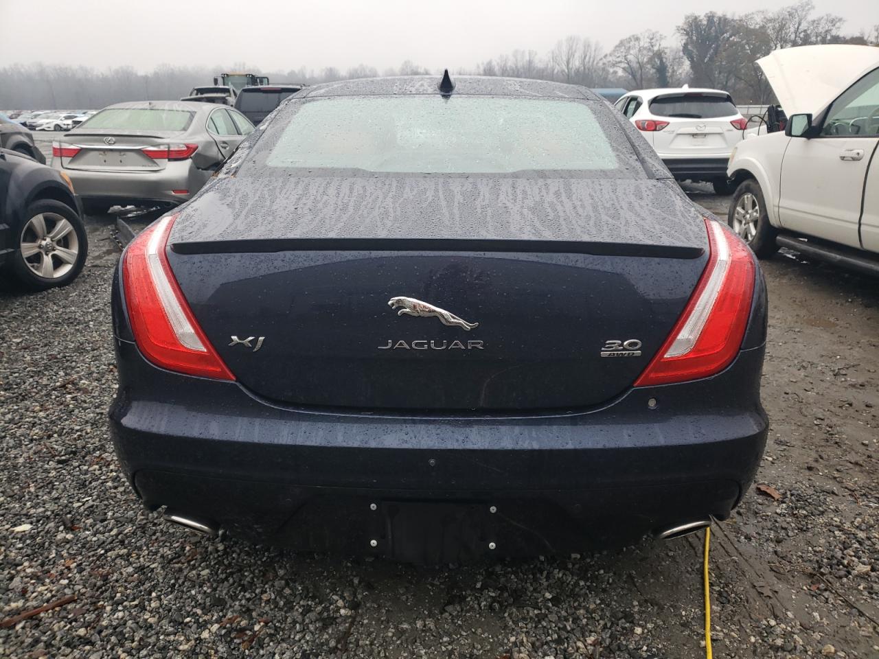 2018 Jaguar XJ VIN SAJWJ1CD4J8W13822 Copart auction photo, side / front end damage thumbnail 6