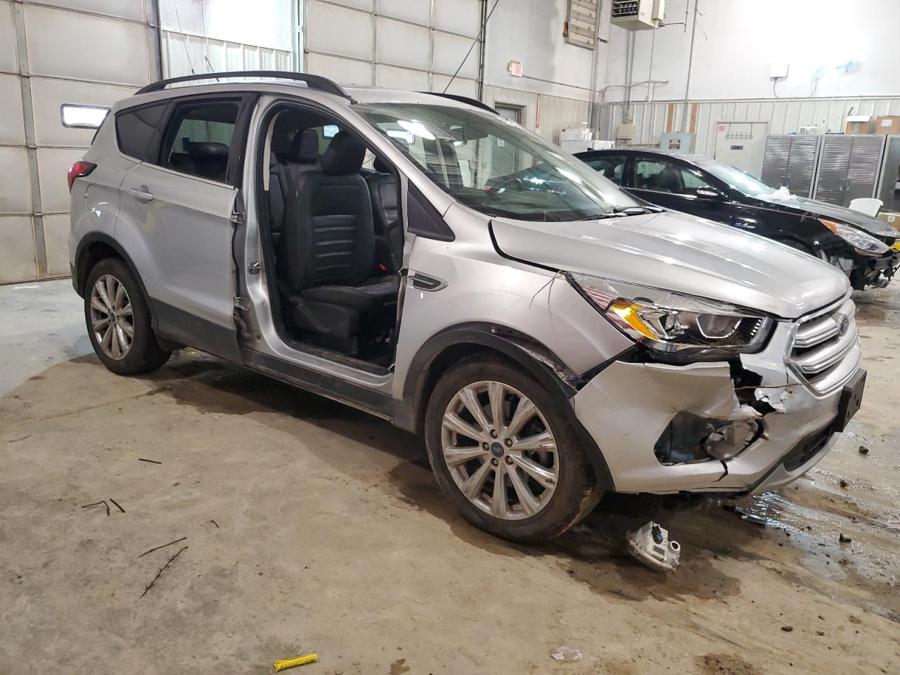 2019 Ford Escape VIN 1FMCU9HD7KUA70034 Copart auction photo, side / front end damage thumbnail 4