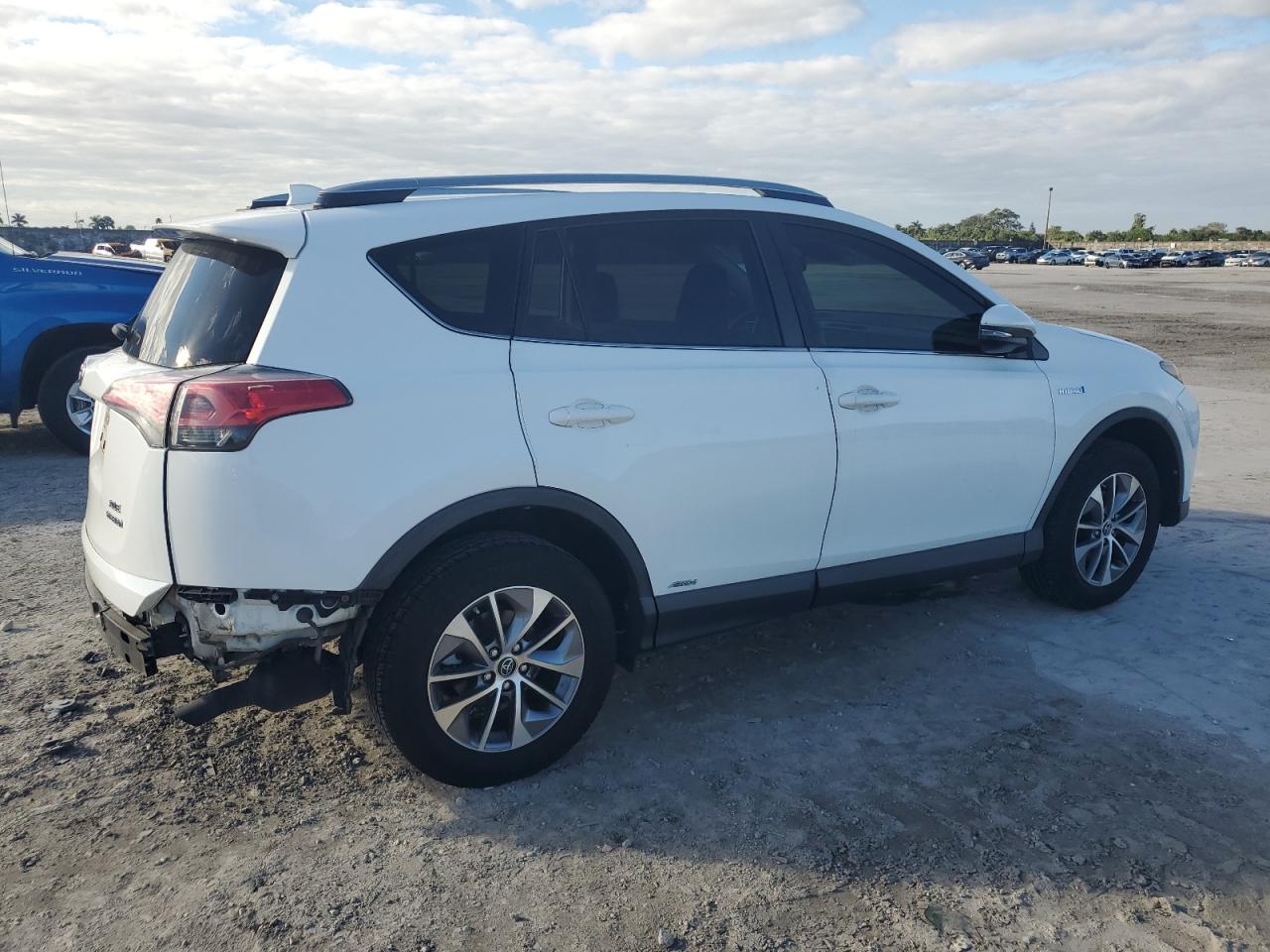 2018 Toyota RAV 4 VIN JTMRJREV5JD216093 Copart auction photo, rear end damage thumbnail 3