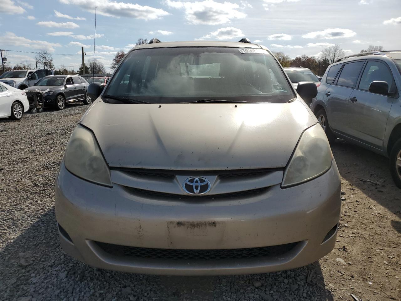 2010 Toyota Sienna VIN 5TDKK4CC5AS325368 Copart auction photo, front end / minor dent/scratches damage thumbnail 5