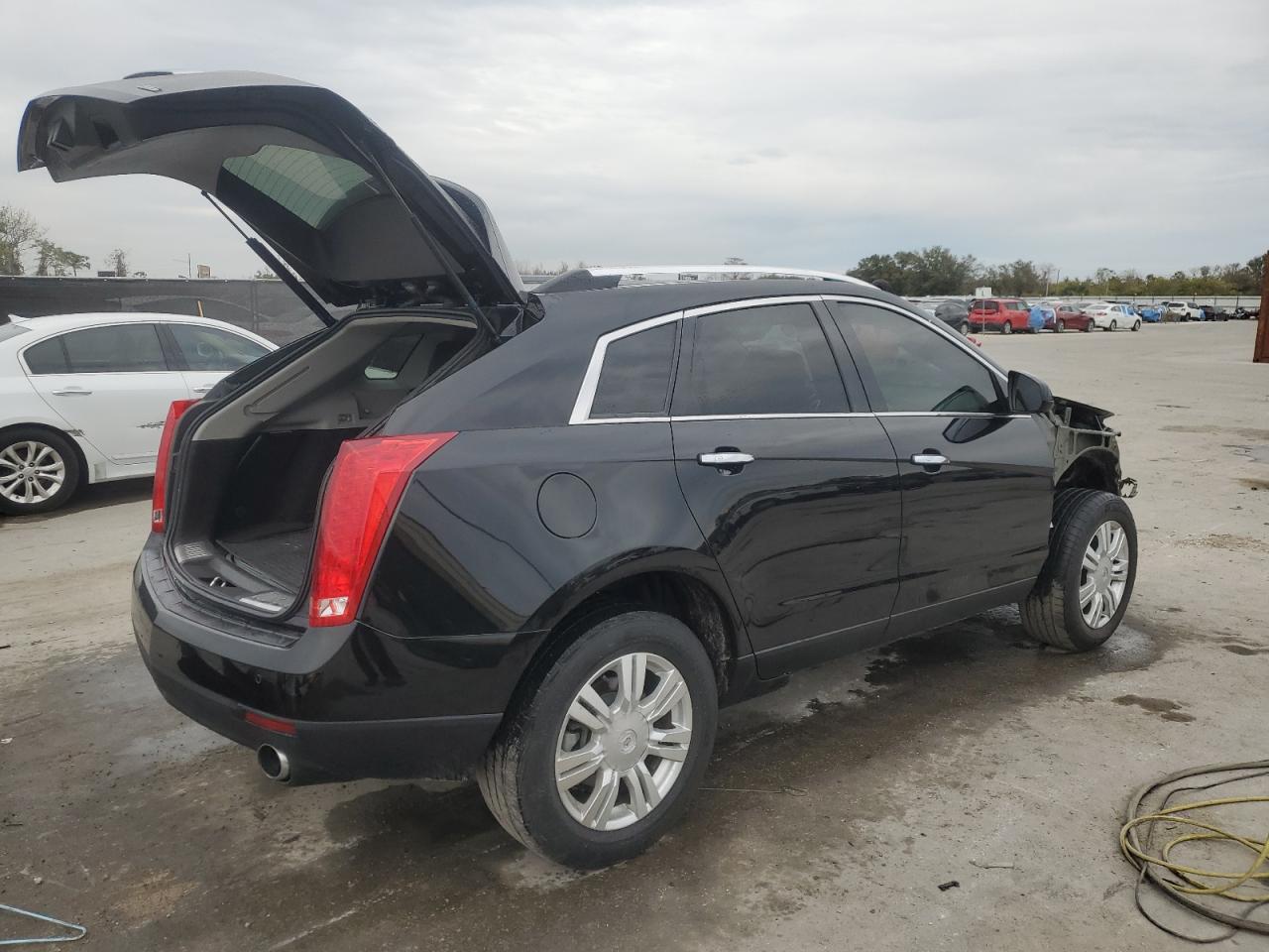 2013 Cadillac SRX VIN 3GYFNCE3XDS635929 Copart auction photo, front end damage thumbnail 3