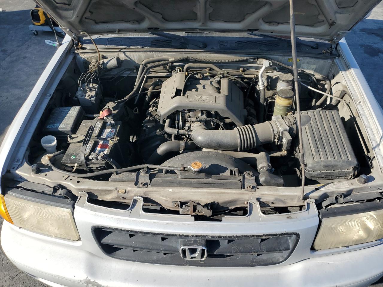1999 Honda Passport VIN 4S6CK58W3X4414697 Copart auction photo, minor dent/scratches damage thumbnail 12
