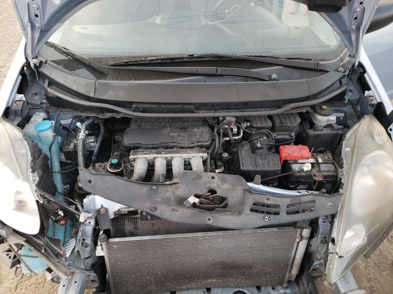 2009 Honda Fit VIN JHMGE88299S032529 Copart auction photo, all over damage thumbnail 11