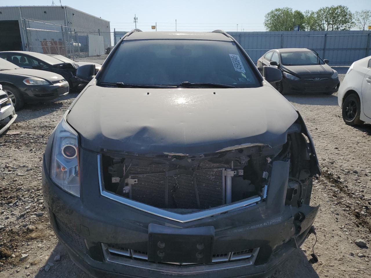 2016 Cadillac SRX VIN 3GYFNAE30GS533161 Copart auction photo, front end / hail damage thumbnail 5