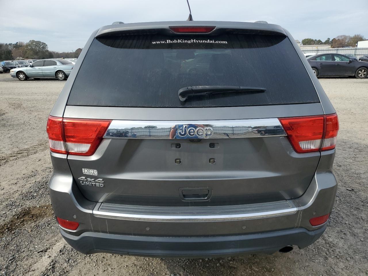 2012 Jeep Grand Cherokee VIN 1C4RJFBG4CC302668 Copart auction photo, front end / undercarriage damage thumbnail 6