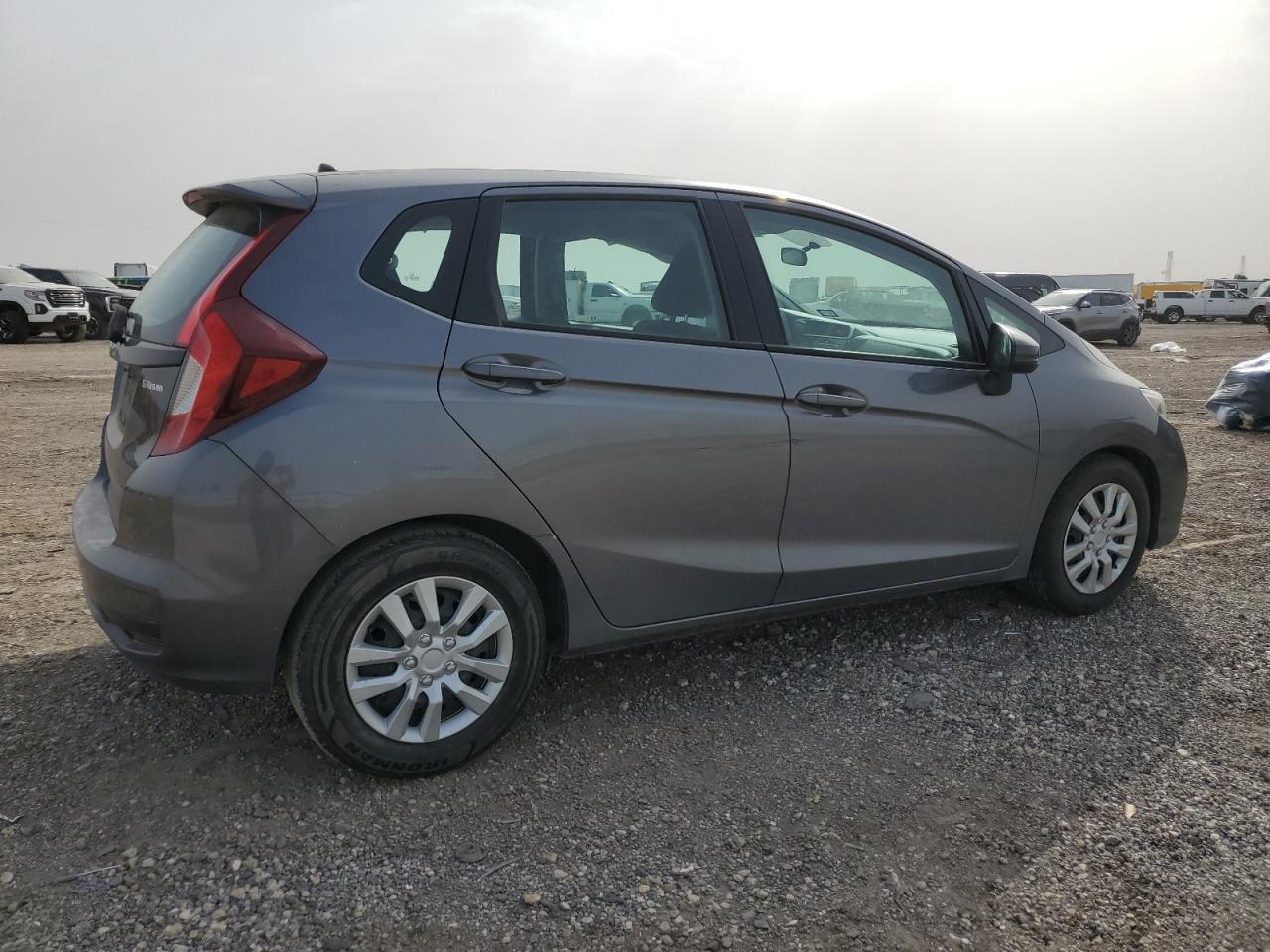 2019 Honda Fit VIN 3HGGK5H46KM747181 Copart auction photo, side / minor dent/scratches damage thumbnail 3
