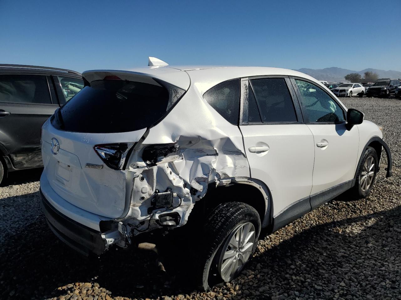 2016 Mazda CX-5 VIN JM3KE2CY5G0785804 Copart auction photo, rear end damage thumbnail 3