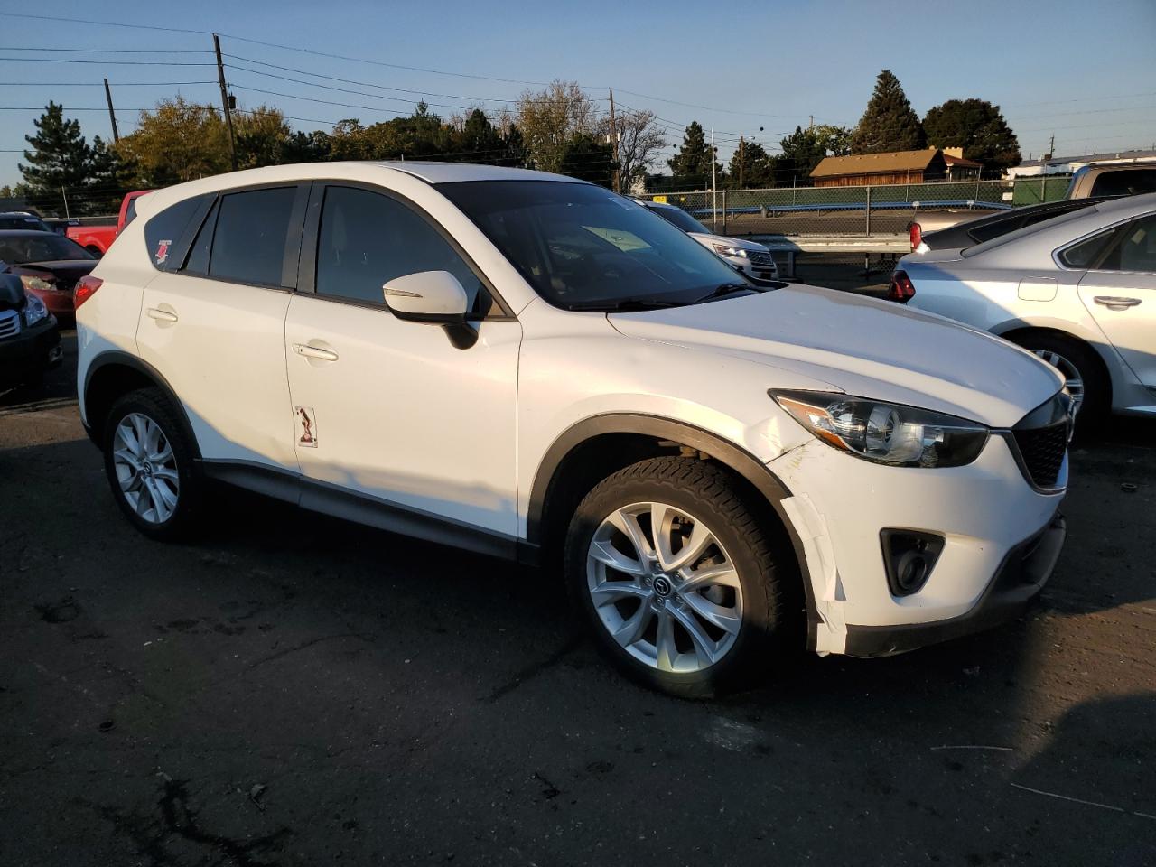 2015 Mazda CX-5 VIN JM3KE4DY1F0550356 Copart auction photo, hail / front end damage thumbnail 4