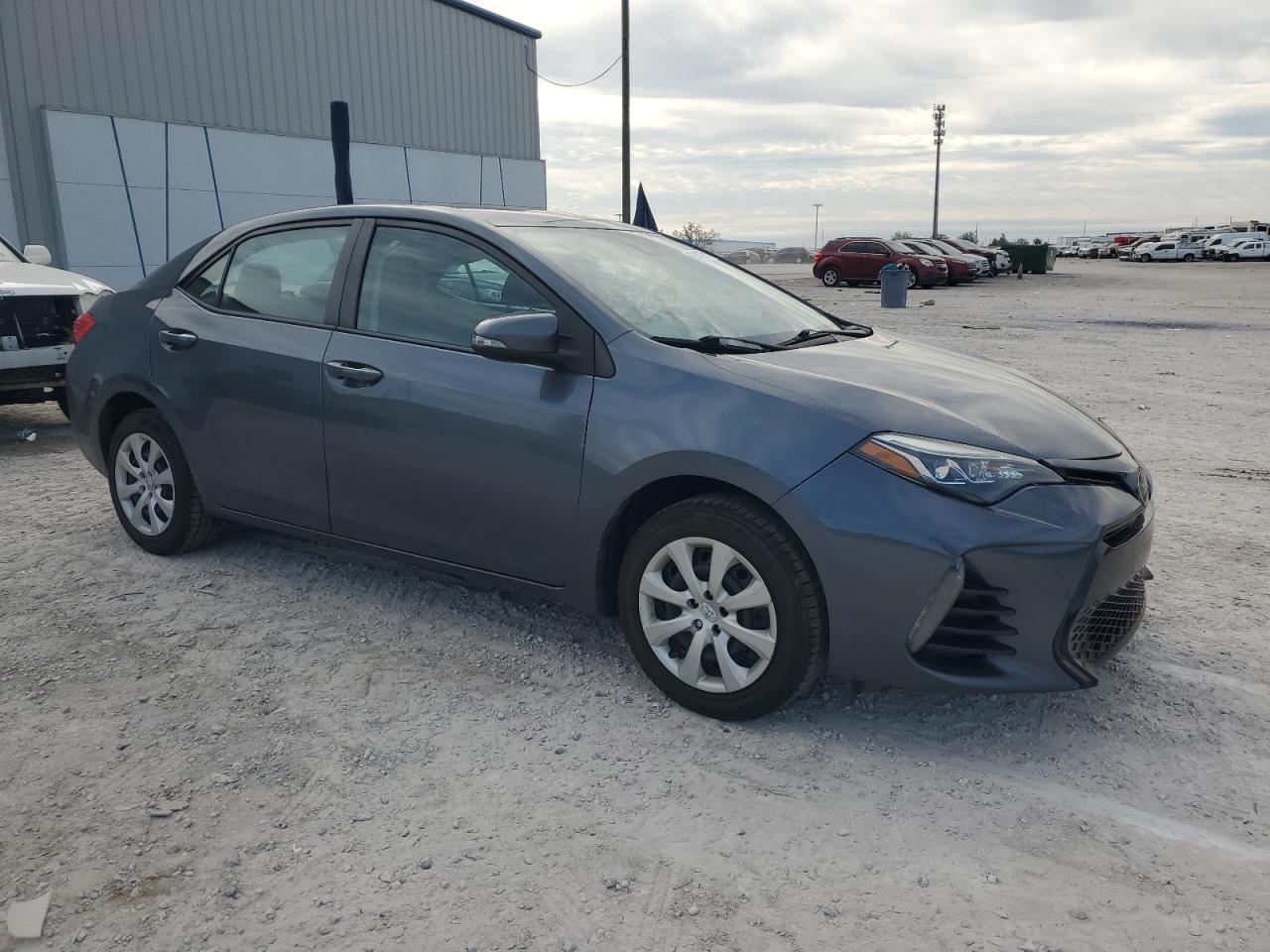 2018 Toyota Corolla VIN 5YFBURHE7JP802795 Copart auction photo, side / rear end damage thumbnail 4