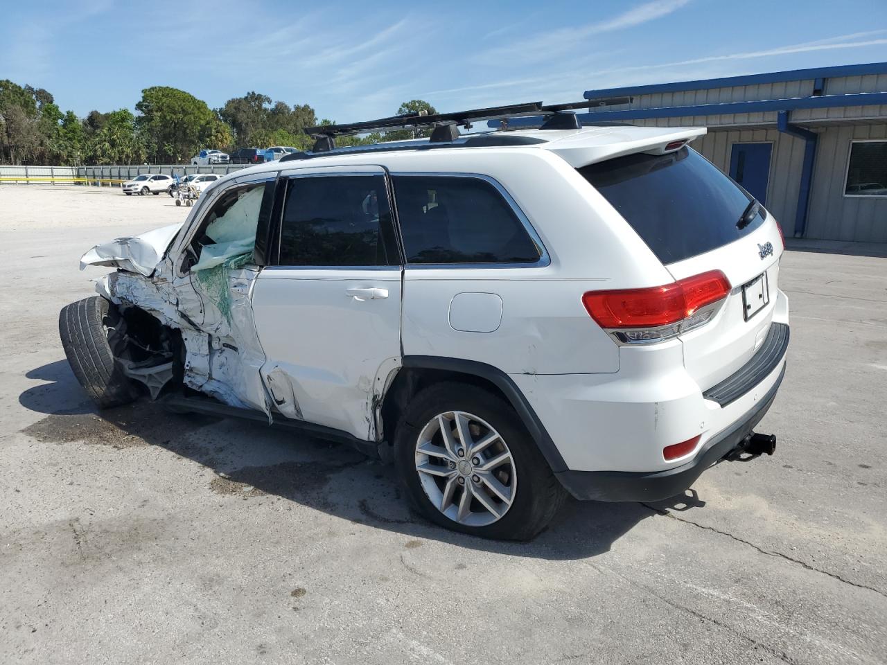 2017 Jeep Grand Cherokee VIN 1C4RJEAG9HC717441 Copart auction photo, side / front end damage thumbnail 2