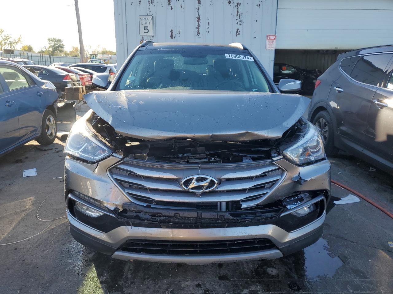 2018 Hyundai Santa Fe VIN 5NMZWDLA5JH055921 Copart auction photo, front end damage thumbnail 5