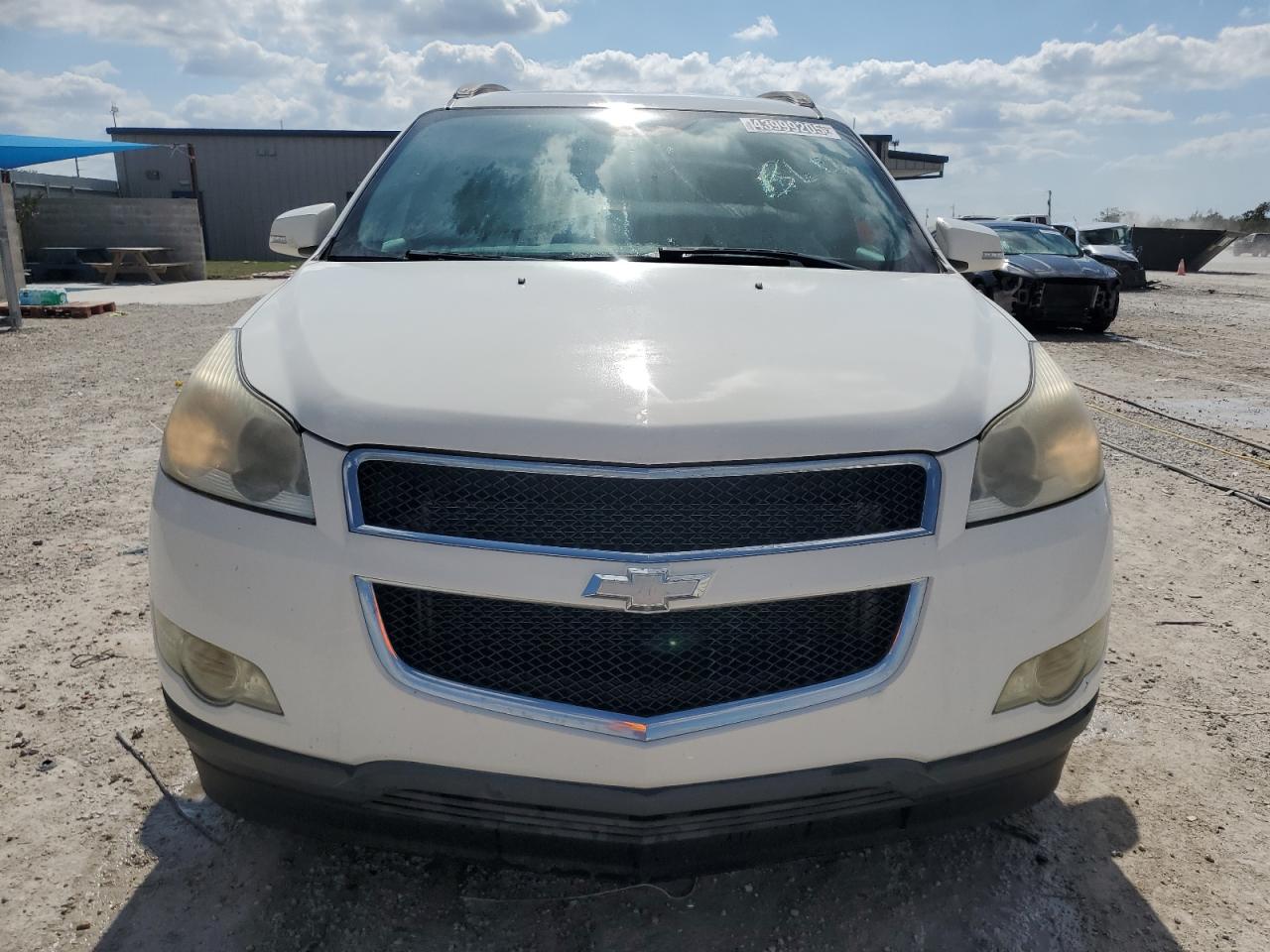 2012 Chevrolet Traverse VIN 1GNKRGED1CJ285381 Copart auction photo, side / rear end damage thumbnail 5