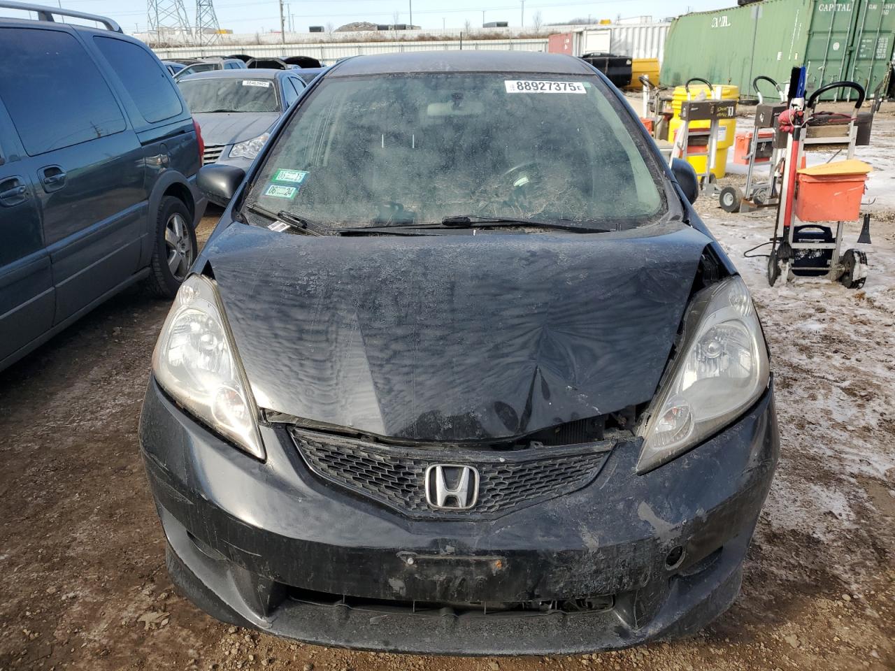 2011 Honda Fit VIN JHMGE8H52BC014318 Copart auction photo, all over damage thumbnail 5