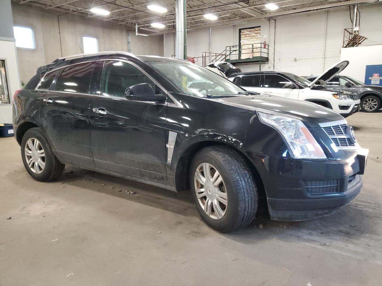 2012 Cadillac SRX VIN 3GYFNAE33CS540583 Copart auction photo, front end damage thumbnail 4