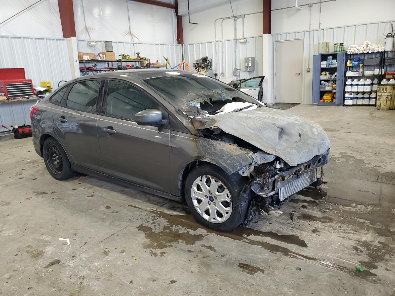 2012 Ford Focus VIN 1FAHP3F21CL463069 Copart auction photo, burn / front end damage thumbnail 4