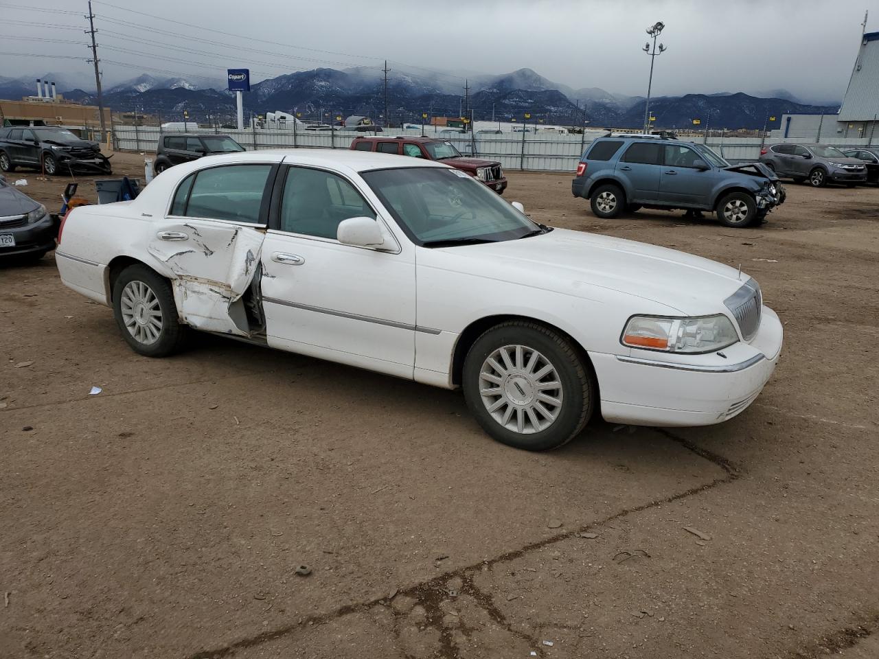 2004 Lincoln Town Car VIN 1LNHM81W24Y613734 Copart auction photo, side / rear end damage thumbnail 4