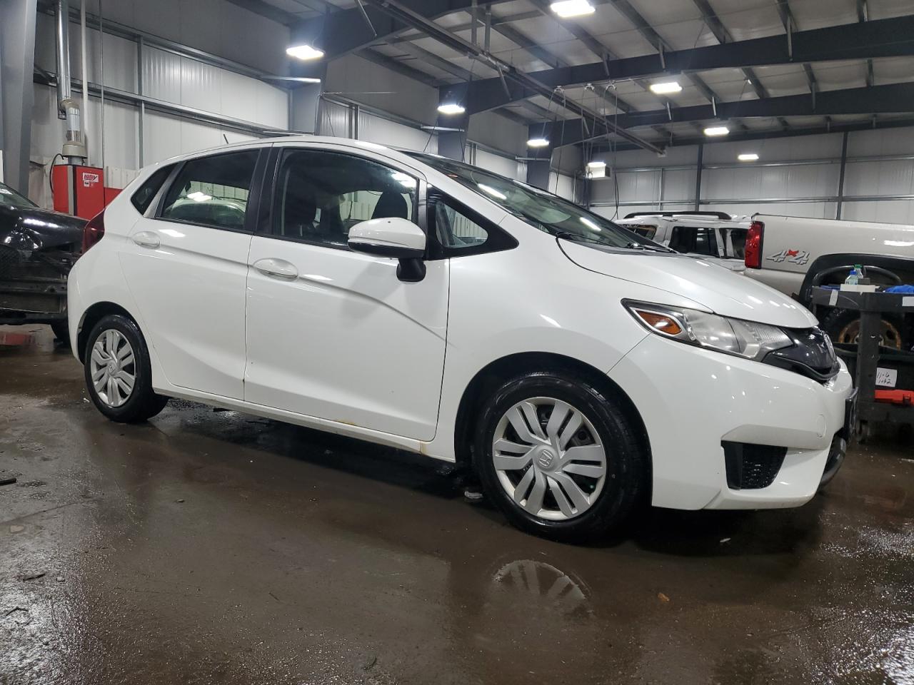2016 Honda Fit VIN JHMGK5H56GX015222 Copart auction photo, side / front end damage thumbnail 4