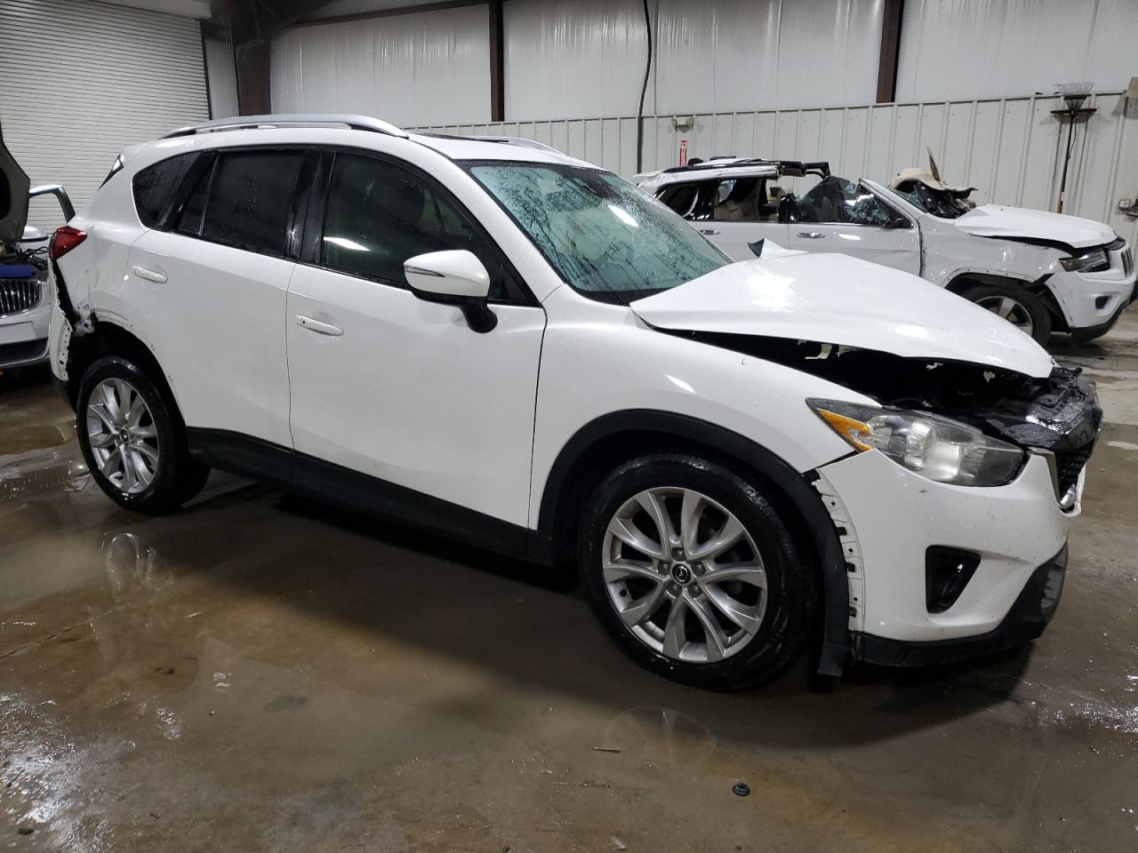 2015 Mazda CX-5 VIN JM3KE4DYXF0552381 Copart auction photo, front end / side damage thumbnail 4
