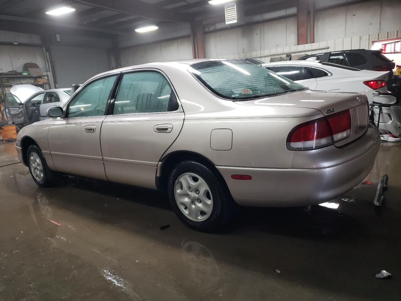 1993 Mazda 626 VIN 1YVGE22A5P5244672 Copart auction photo, side damage thumbnail 2