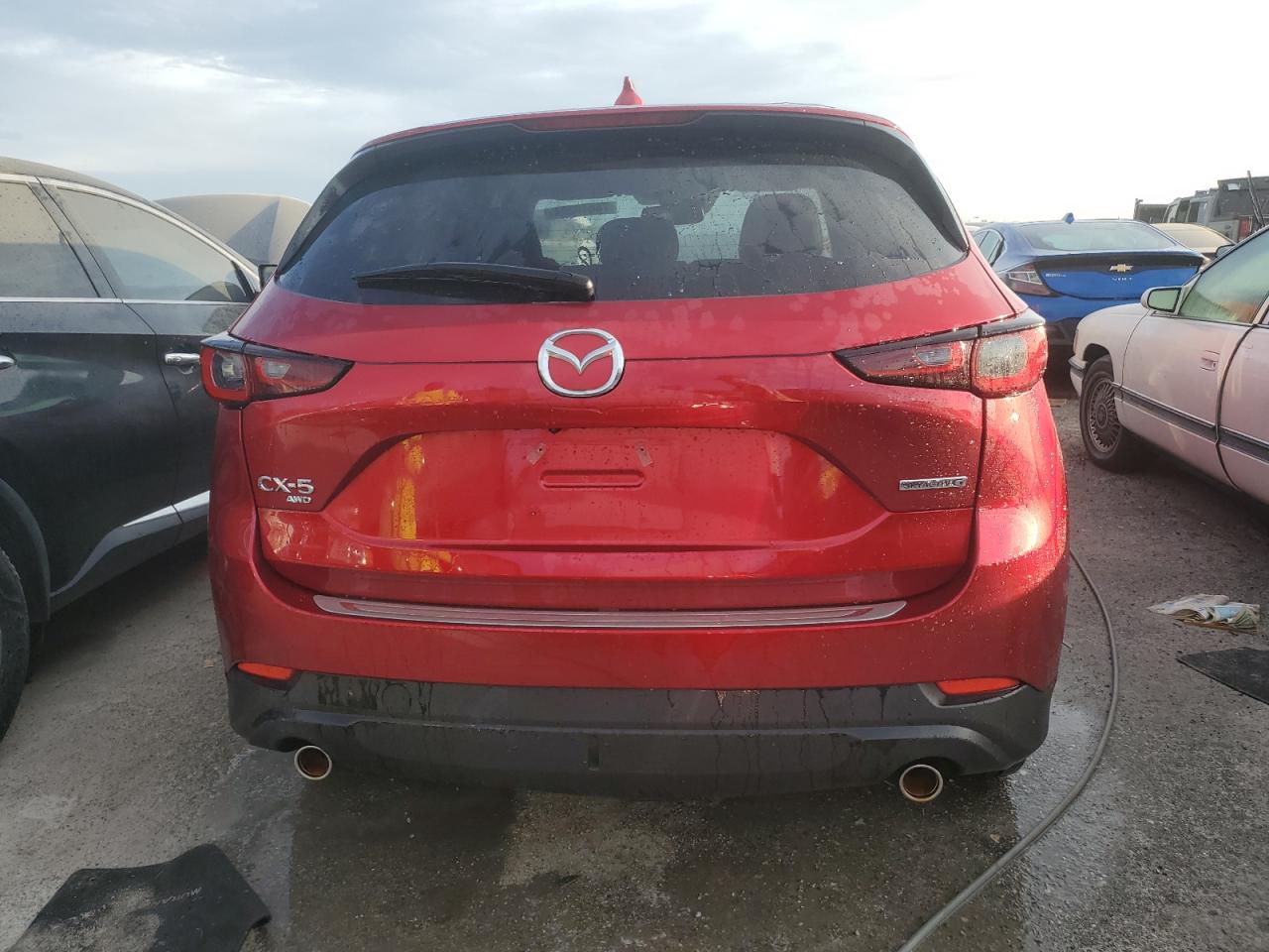 2023 Mazda CX-5 VIN JM3KFBEMXP0129282 Copart auction photo, water/flood damage thumbnail 6