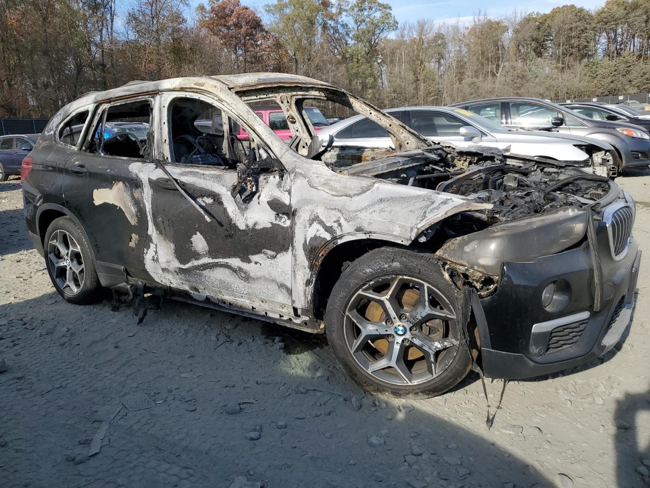 2017 BMW X1 VIN WBXHT3C37H5F79445 Copart auction photo, burn damage thumbnail 4