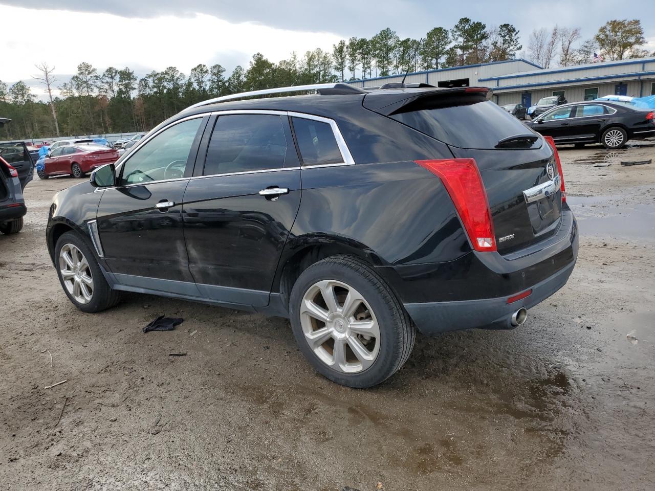 2016 Cadillac SRX VIN 3GYFNBE36GS556109 Copart auction photo, vandalism damage thumbnail 2