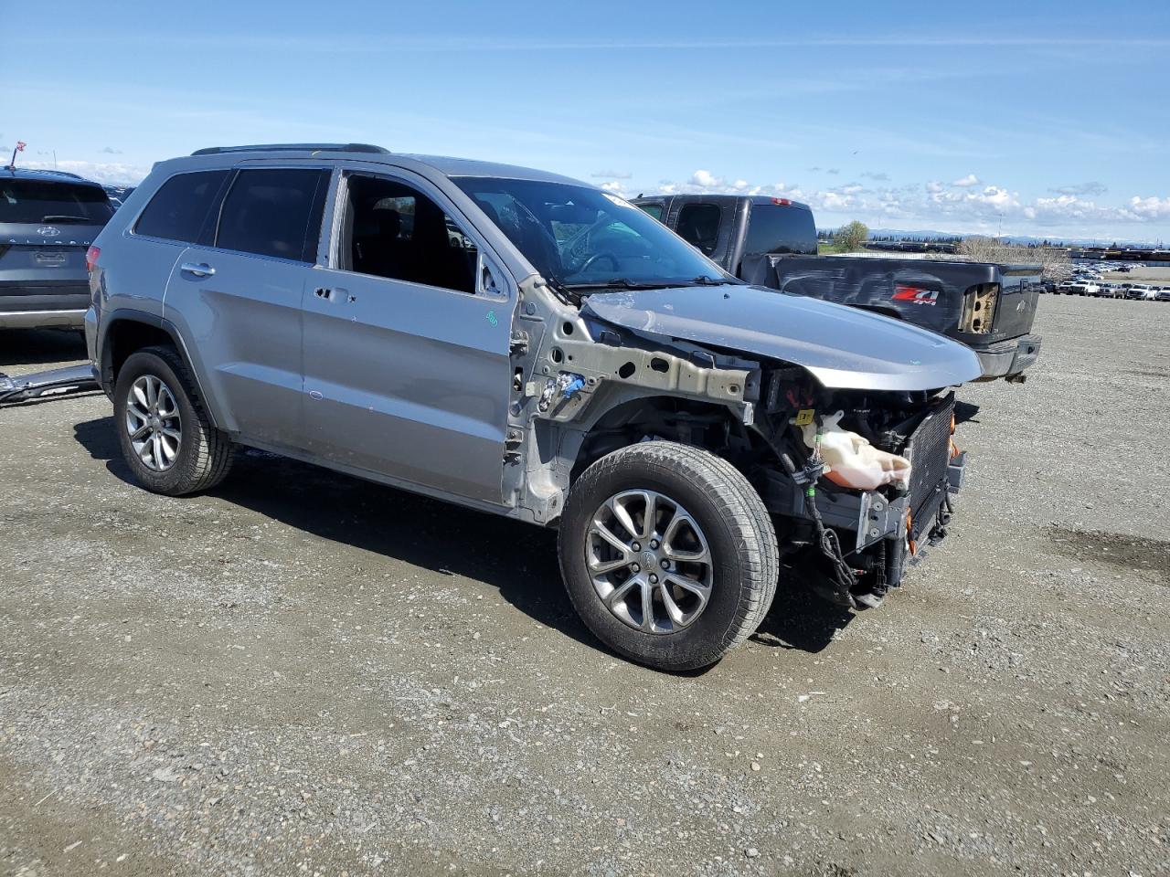 2015 Jeep Grand Cherokee VIN 1C4RJFBG3FC775658 Copart auction photo, front end / side damage thumbnail 4