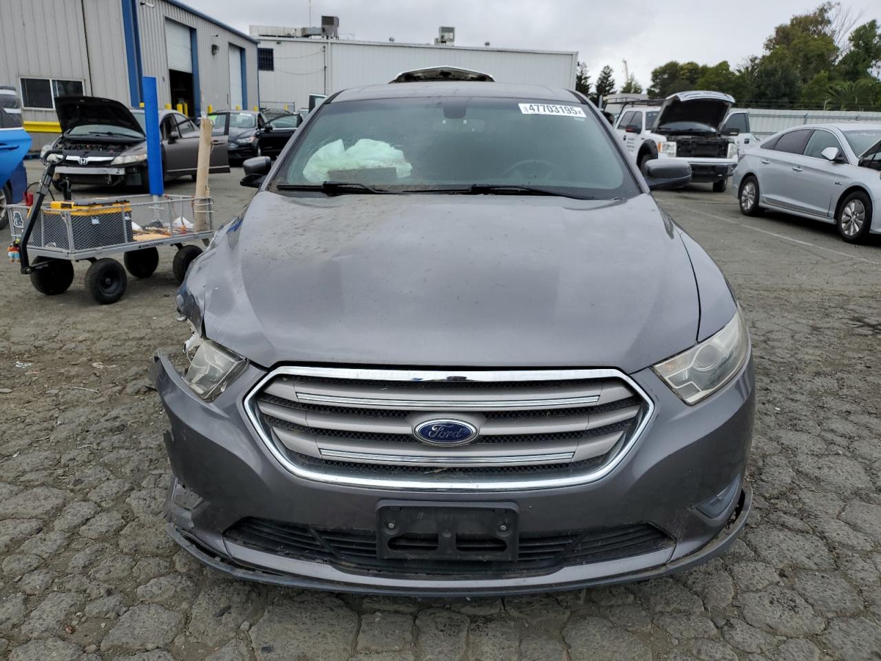 2014 Ford Taurus VIN 1FAHP2E87EG137966 Copart auction photo, front end / all over damage thumbnail 5