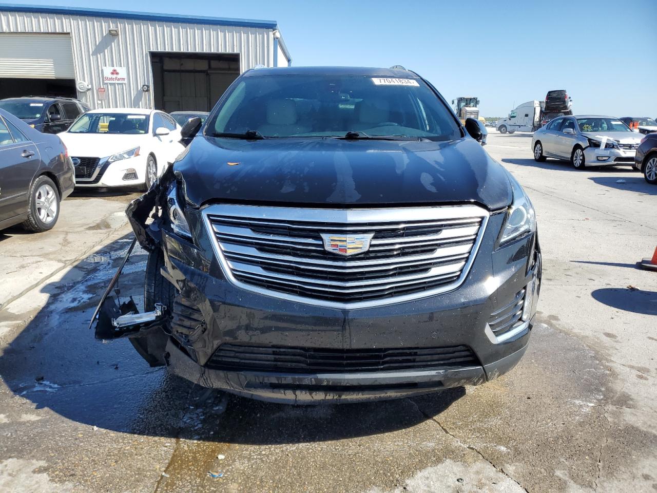 2019 Cadillac XT5 VIN 1GYKNCRS0KZ231537 Copart auction photo, front end / side damage thumbnail 5
