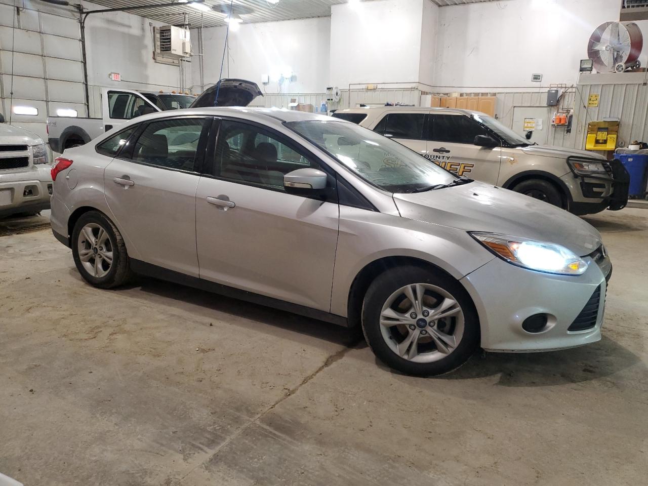 2014 Ford Focus VIN 1FADP3F28EL421659 Copart auction photo, front end / minor dent/scratches damage thumbnail 4