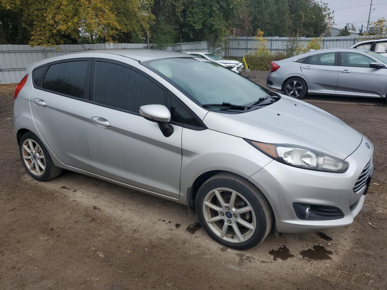 2015 Ford Fiesta VIN 3FADP4EJ8FM112546 Copart auction photo, front end / side damage thumbnail 4