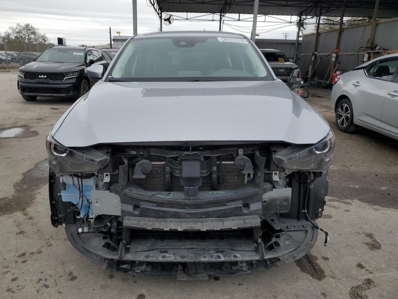 2020 Mazda CX-5 VIN JM3KFBCM7L0735703 Copart auction photo, side / front end damage thumbnail 5