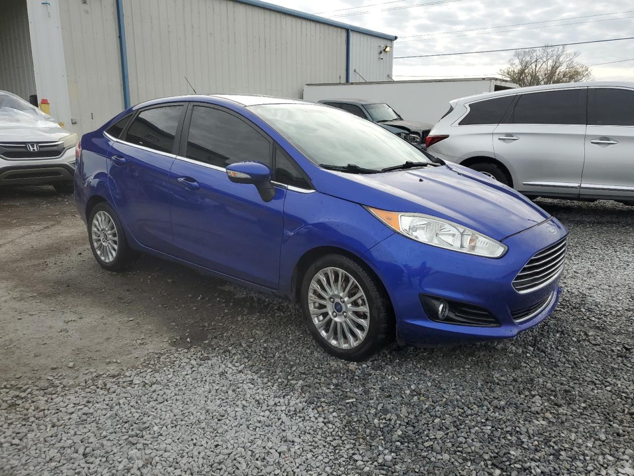 2014 Ford Fiesta VIN 3FADP4CJ2EM205399 Copart auction photo, side / front end damage thumbnail 4