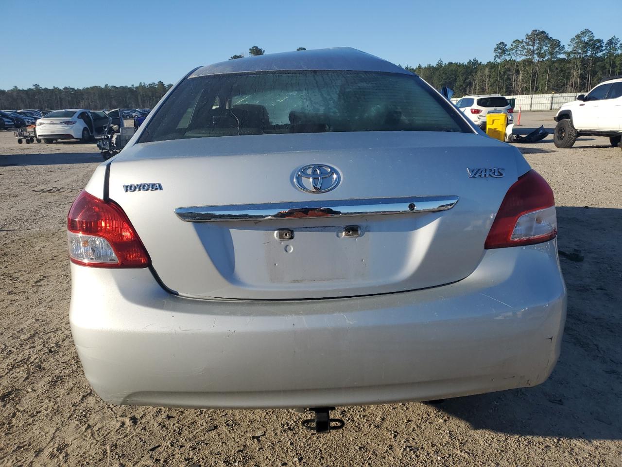 2010 Toyota Yaris VIN JTDBT4K39A4068628 Copart auction photo, side / top/roof damage thumbnail 6
