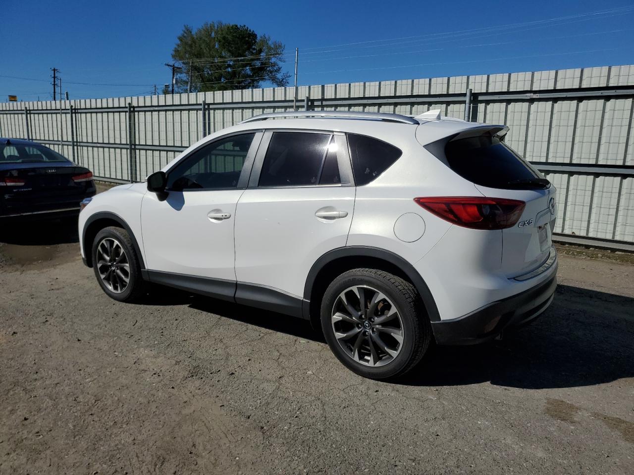 2016 Mazda CX-5 VIN JM3KE2DYXG0702124 Copart auction photo, front end / minor dent/scratches damage thumbnail 2